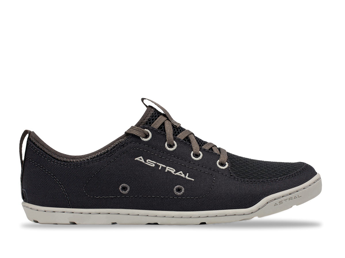 Side view of an Astral Loyak dark grey/black water shoe with white sole, eyelets, and grey laces on black background.