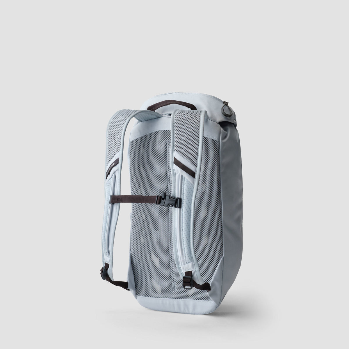 Gregory Nano 16 light blue backpack, rear view with mesh shoulder straps, adjustable chest buckle, and top carry handle.