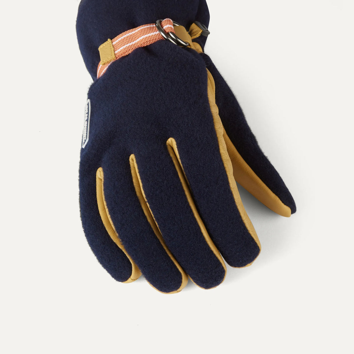 Sealskinz Toftwood Gloves: dark blue with tan leather palms, featuring an orange striped wrist strap and metal buckle.