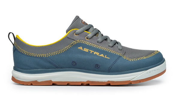 Astral Brewer water shoe in blue and grey with yellow accents, mesh upper, and grippy brown sole, isolated on white.