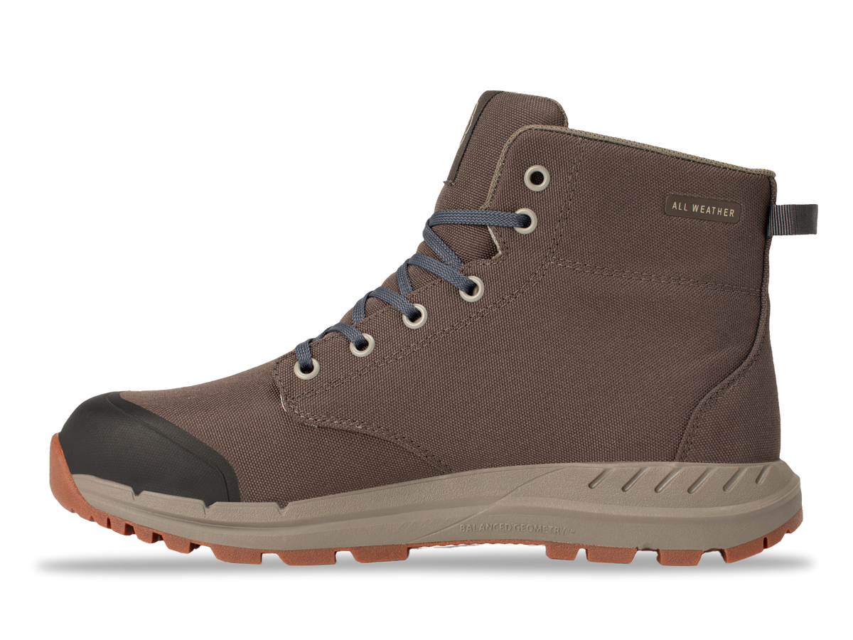 Astral Pisgah brown all-weather boot with grey laces, black toe cap, and a tan lug sole on a black background.