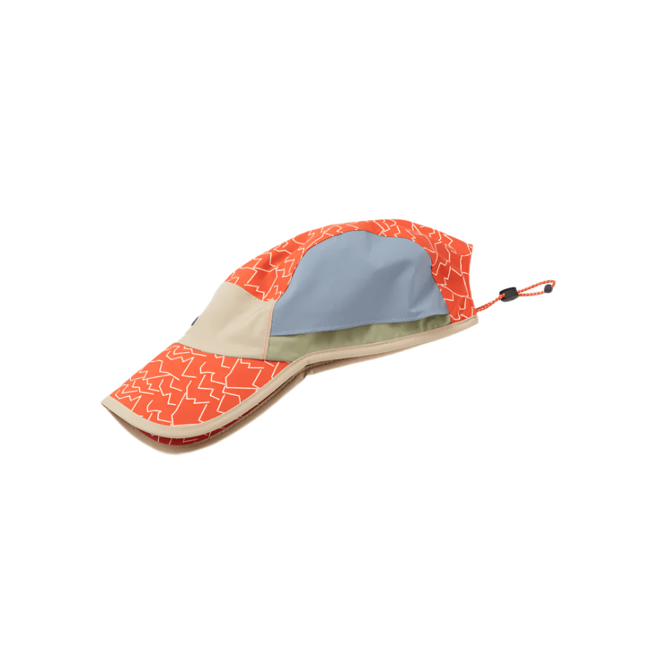 Poringland Hat by Sealskinz, multi-colored cap with orange pattern, blue panel, beige accents, and adjustable cord.