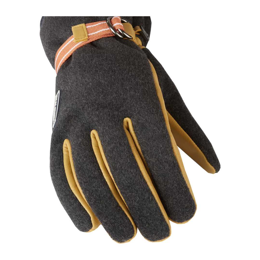 Sealskinz Toftwood Gloves. Close-up of a grey glove with tan leather palm and fingers, featuring an orange and white striped wrist strap.