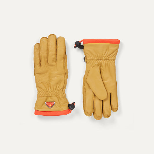 Pair of Sealskinz Westfield Gloves in tan leather with bright orange cuffs, one featuring the brand logo.