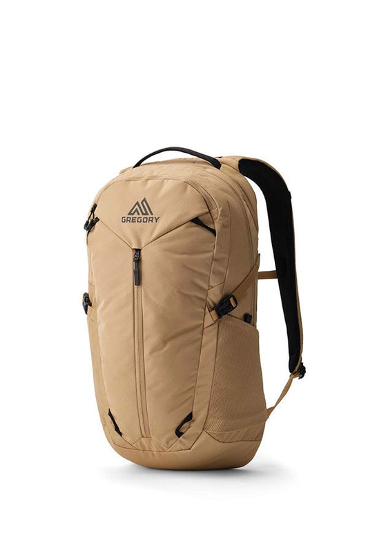 Gregory Signal 18 backpack in tan, showing the front with a main zipper, side mesh pocket, top handle, and shoulder straps.