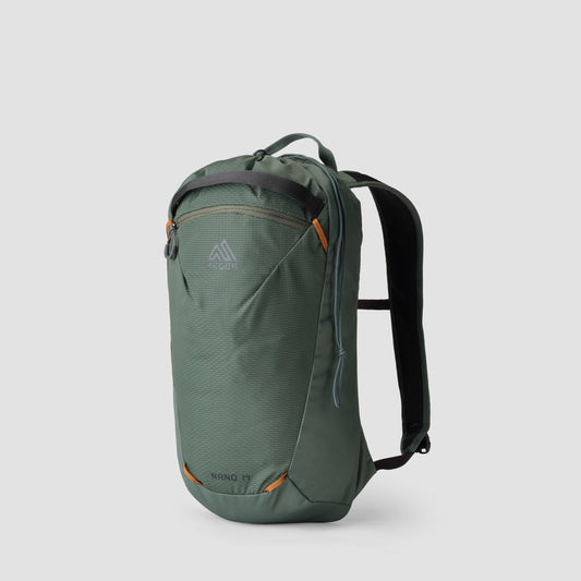 Green Gregory Nano 14 backpack with orange accents, lightweight daypack for hiking & daily use, on a grey background.