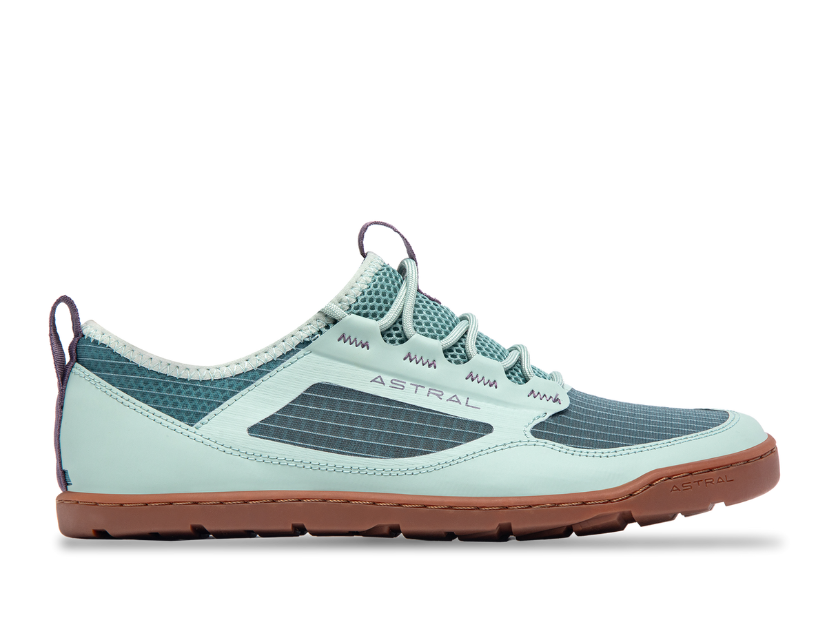 Astral Loyak AC light blue water shoes with dark mesh upper and brown rubber sole, side view.