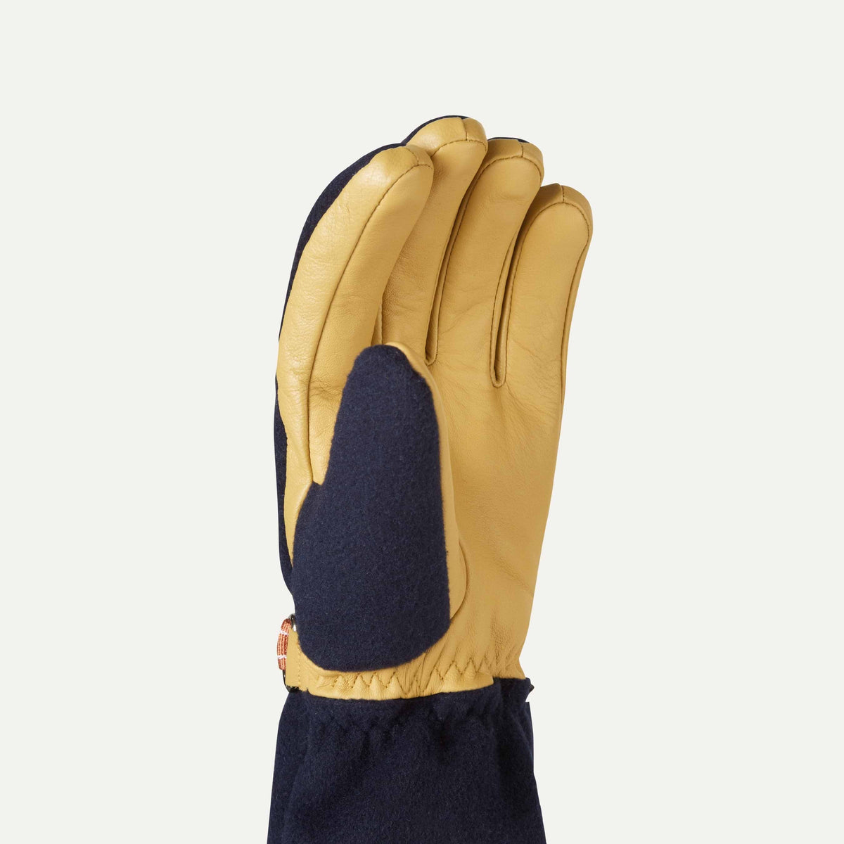 Sealskinz Toftwood Gloves with tan leather palms and navy fabric back, shown upright on a white background.