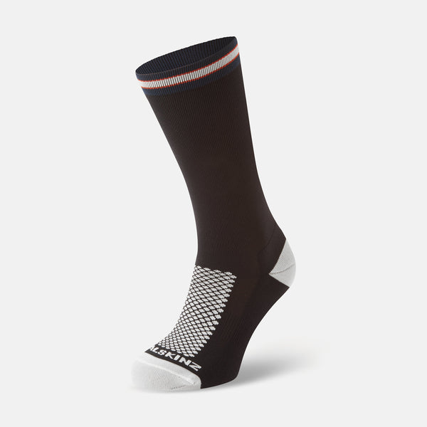 Sealskinz Caister Socks in black with white toe, heel, and textured sole. Features a striped cuff for style and comfort.