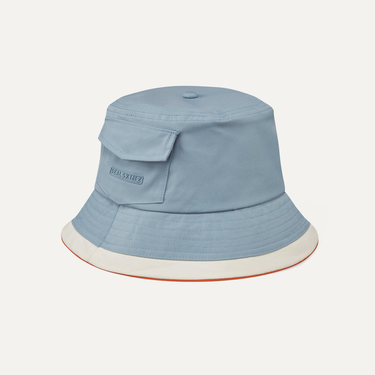 Sealskinz Seething light blue bucket hat with a small front pocket, white brim, and orange accent.