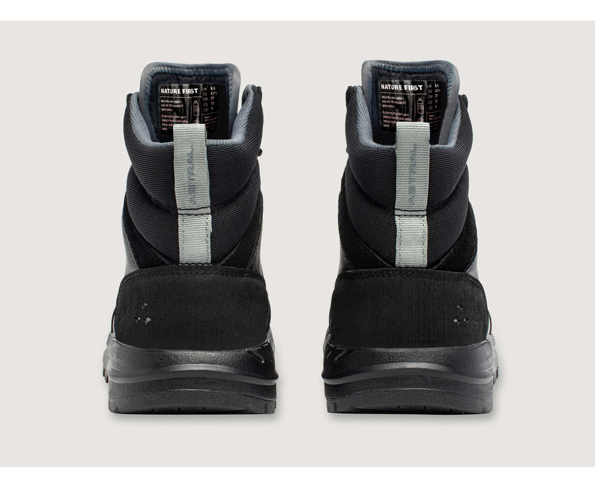 Two black Astral Tr1 Merge boots, shown from the back, highlighting their design and durable construction.