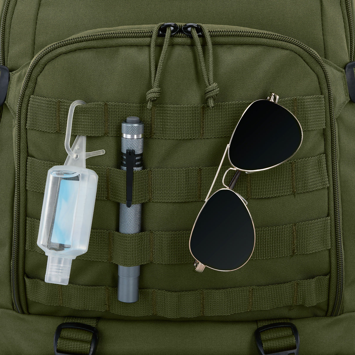 High Sierra Pathsetter Backpack: Close-up of green backpack with hand sanitizer, flashlight, and sunglasses attached to MOLLE webbing.
