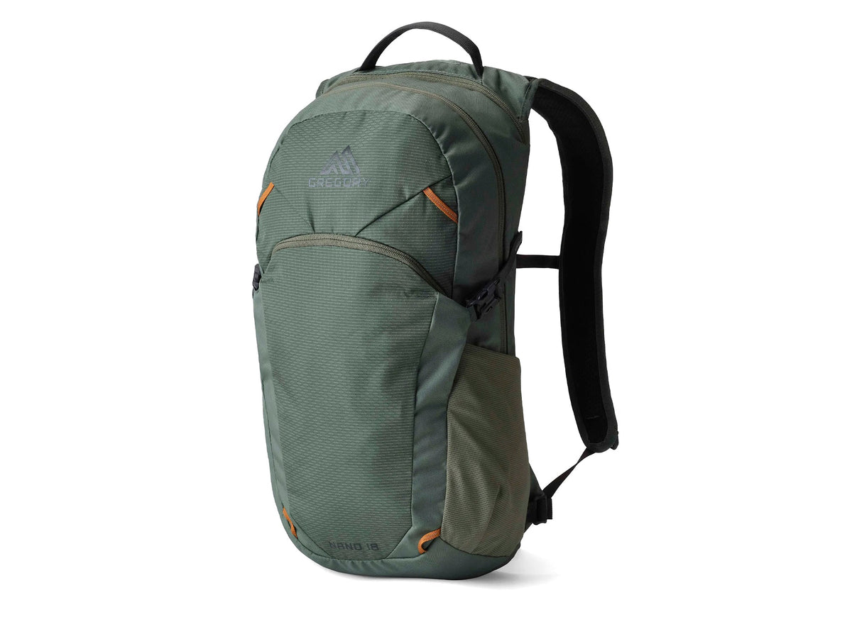 Green Gregory Nano 18 backpack with orange accents, ideal for hiking, everyday carry, and outdoor adventures.