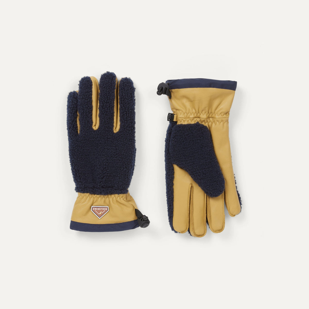 Sealskinz Garvestone Gloves in two-tone tan leather and navy fleece, designed for outdoor warmth and protection.